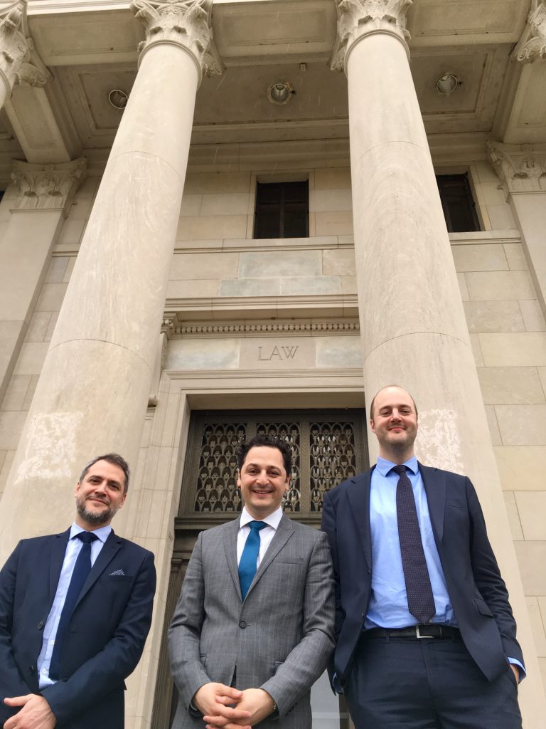 Prof. Roda, Séjean, and Haftel in front of the LSU Law Building