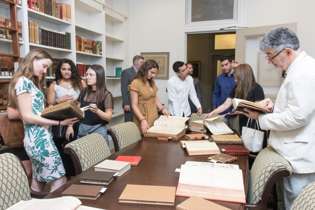 The group perusing old law books in the rare book room