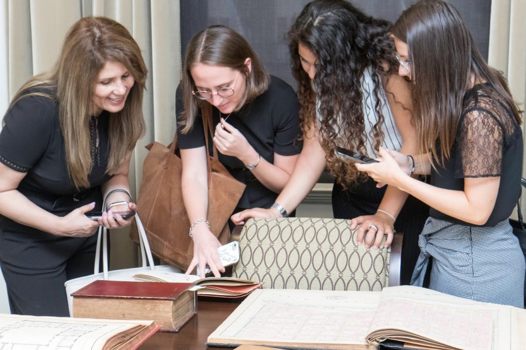 LLM students marveling at a rare book